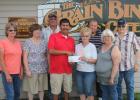 Beltrami County Commissioner, Tim Sumner, was in Grygla to present the checks to the various organizations. Above, L-R: Wally Bklum and Jean Foss (Con-Con Fund Board Members), Lynn Anderson (accepting on behalf of the Grygla Fire & Rescue), Tim Sumner, Bob Thompson (accepting on behalf of the Grygla Fire & Rescue and also as a Grygla Centennial Committee member), Ray Benson and Ray Hendrickson (Con-Con Fund Board Members).