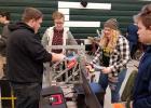 Iron Chargers working on one of their robots at a recent competition. Photo courtesy of Grygla School