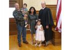 Bill and Lolit Neuschwander with their children and presiding judge.