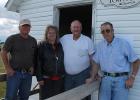 David Vraa, Adeline Olson, Galen Quam and Danny Holen are pictured in front of the Reiner Town Hall where a picnic was held last week in honor of the three men, who retired after decades of dedicated service to their township in rural Goodridge.
