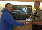 Marshall County Sheriff’s Office is gladly accepting any donations from the public to be used towards the purchase of a new K-9 unit. Deputy Gillund has been assigned the new role of K-9 officer for the department. He is pictured accepting a donation from Josh Veselka, of Ericco Manufacturing in Viking.

