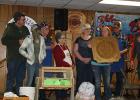 Kent Bergerson, on the right, Oklee Fire Department Chief presented a plaque to the Gonvick American Legion for their work during the Firemen’s Blizzard Bonanza for frying fish. Accepting the award made by Deer Park Creations were Michael Okstad, Carlie Coulter, LeRoy Sundquist, Louise Sundquist, Alice Okstad, Candace Coulter and Eldin Okstad. 