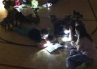 Students enjoy the flashlight reading.