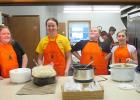 Elizabeth Svor, Beth Podoll, Trinity Lee and Carlie Coulte were part of the kitchen crew at the annual Hunters Supper Event in Gully on opening Saturday of Deer Season. Lund Lutheran Church Congregation and Friends and Family were stylin’ in festive new blaze orange aprons while they served up a meal fit for hungry hunters.  