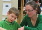 William Klawitter and his mom, Holly make an art project during Math Fun Night at Win-E-Mac School.